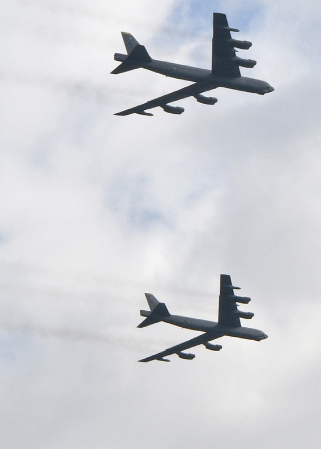 image of two B-52 bombers flying during a routine training event