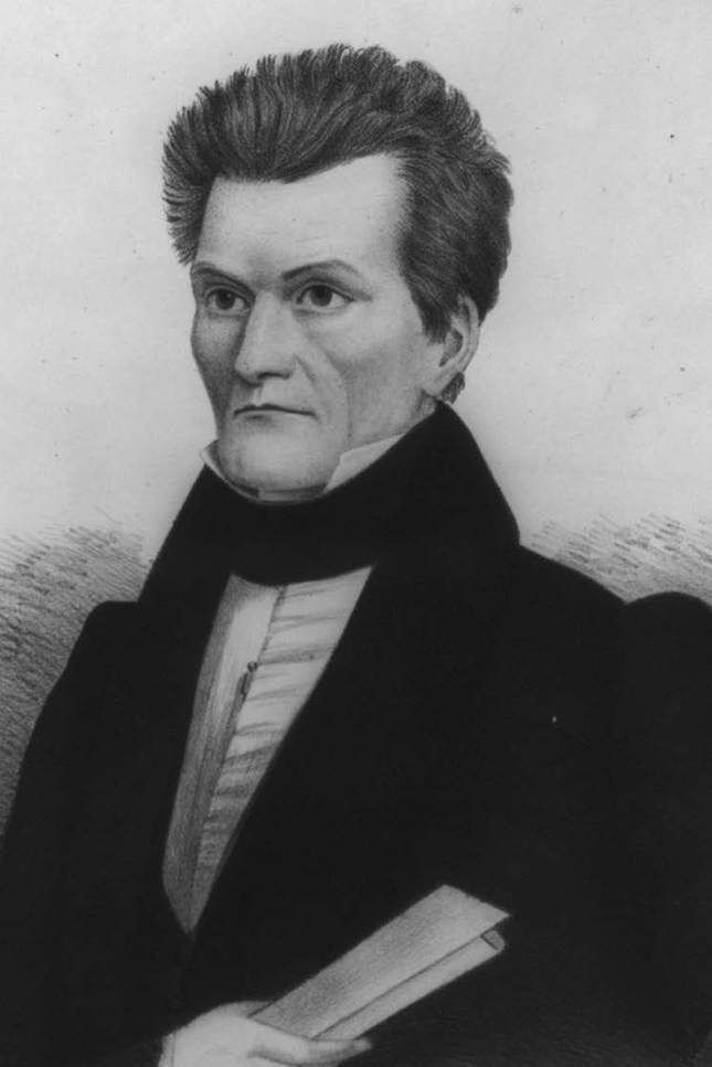  A black and white portrait drawing of a man in formal 19th century attire with a high collar and cravat. He wears a dark coat and is shown from chest up, holding what appears to be a book in his hand. He has distinctive features with somewhat stern expression and styled hair characteristic of the early-to-mid 1800s.