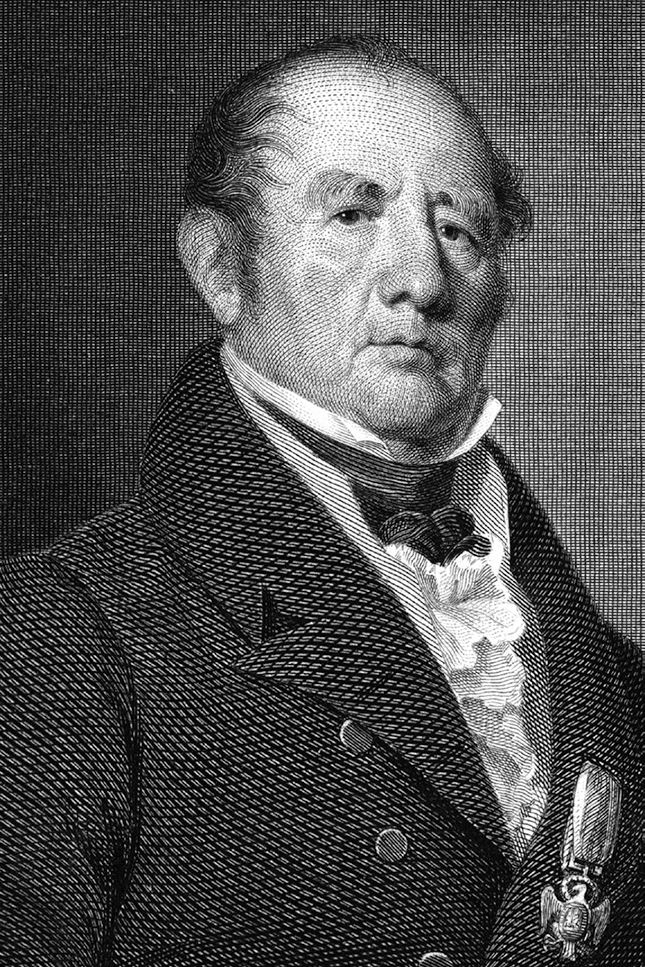 A detailed black and white engraving of an older gentleman from the early 19th century. The image shows fine line work characteristic of period engravings. The subject has a receding hairline with hair swept to the sides, and wears a high-collared formal coat with white cravat and vest. He has a slight medal or decoration visible on his chest. The portrait presents him looking slightly to the side with a dignified expression.