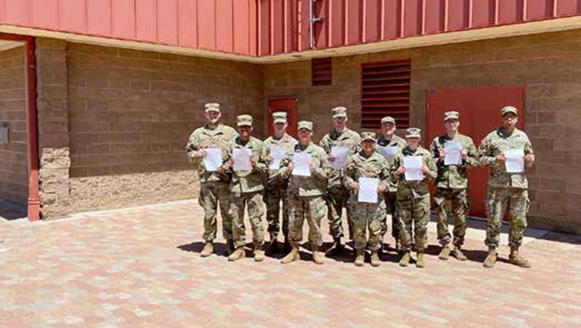 Picture of a 10 soldiers standing outside the federal aviation administration