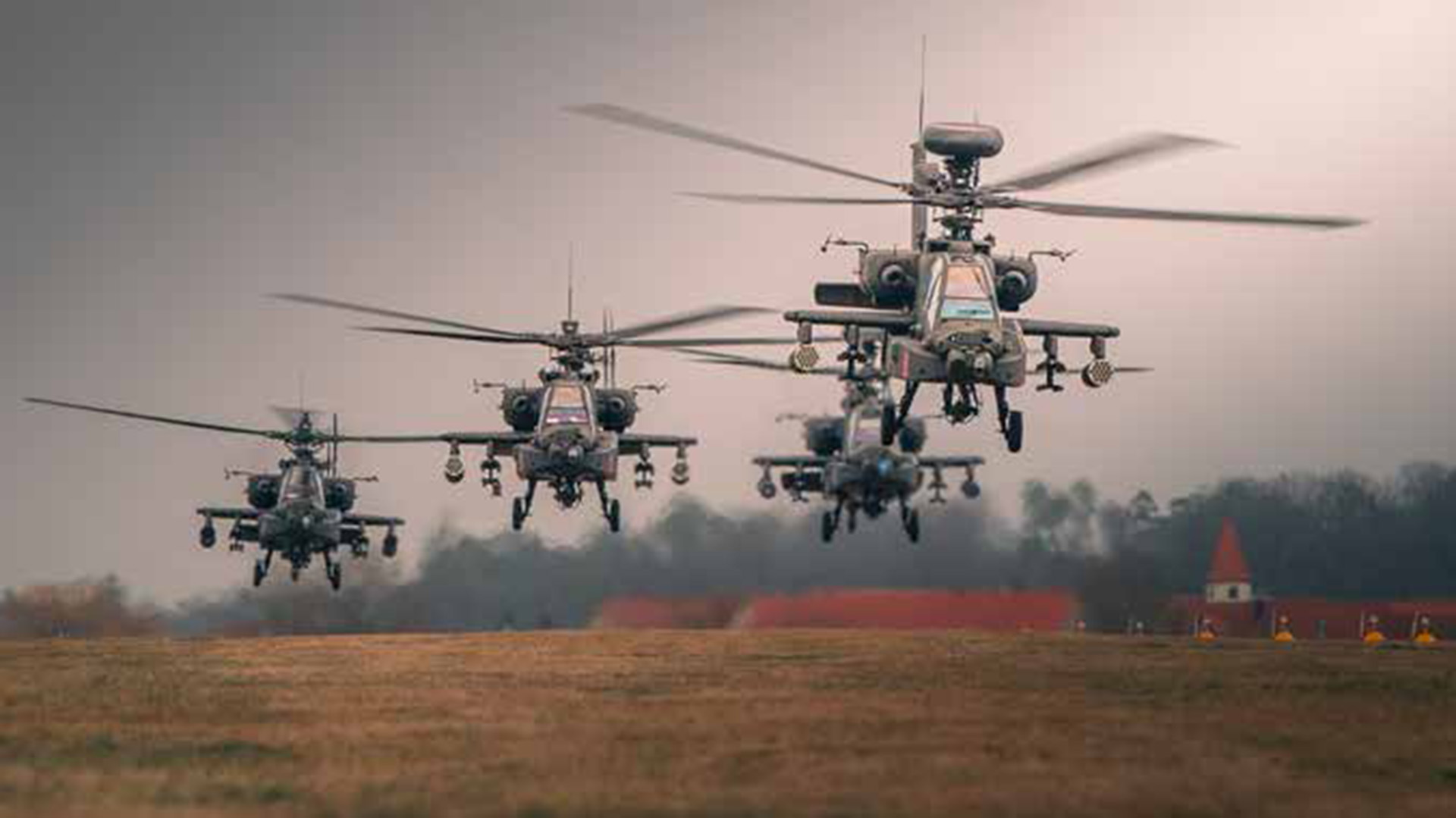 picture of 4 apache helicopters flying during the attack portion of a training mission in germany 