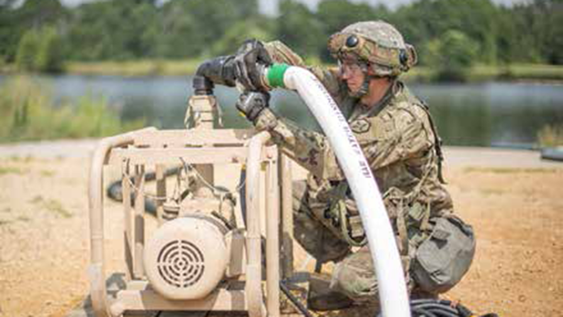 picture of A U.S. Army Reserve Private operates an electric raw water pump during combat support training at Fort McCoy, Wisconsin.