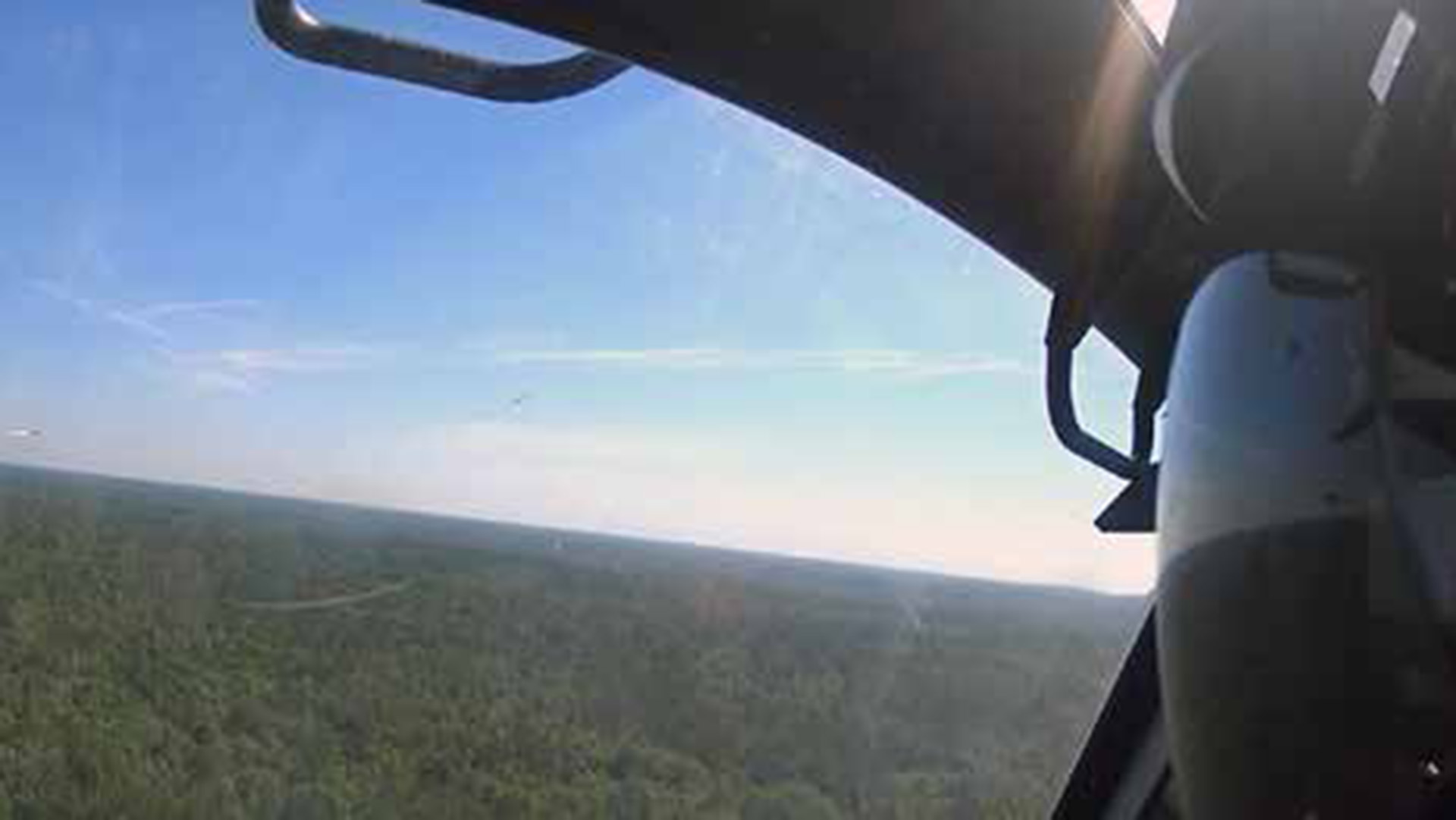 Picture shows a helicopter firing a missile at a target