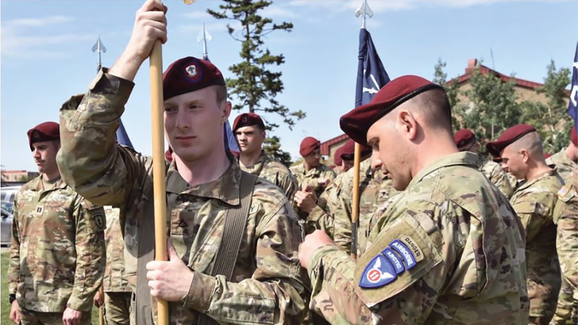Soldiers stand in formation as they receive their new 11th Airborne Division patches.