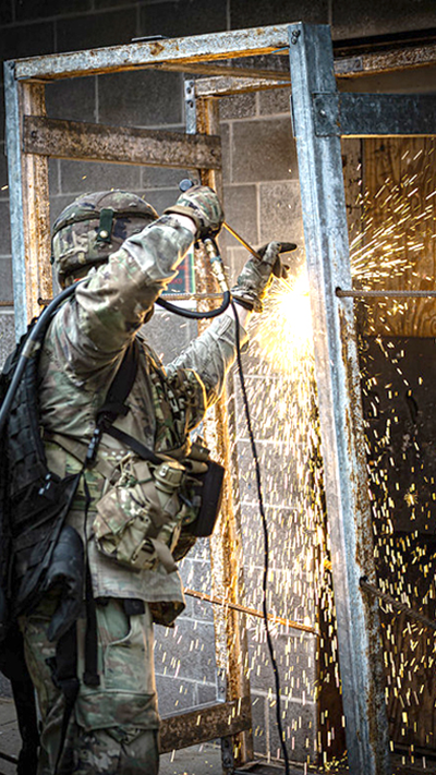 A Soldier welds a rectangular frame
