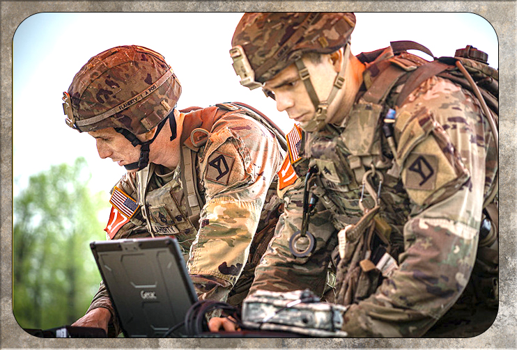 Two Soldiers plan an operation on a map