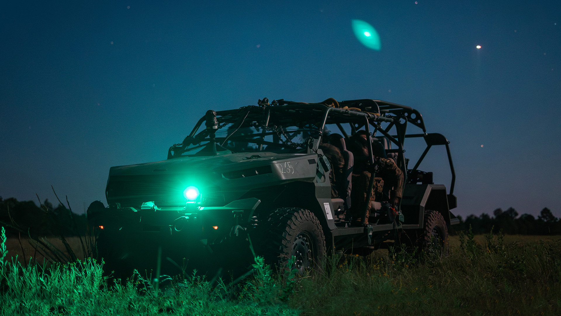 Soldiers from the 2nd Mobile Brigade Combat Team in a squad vehicle during night operations. 